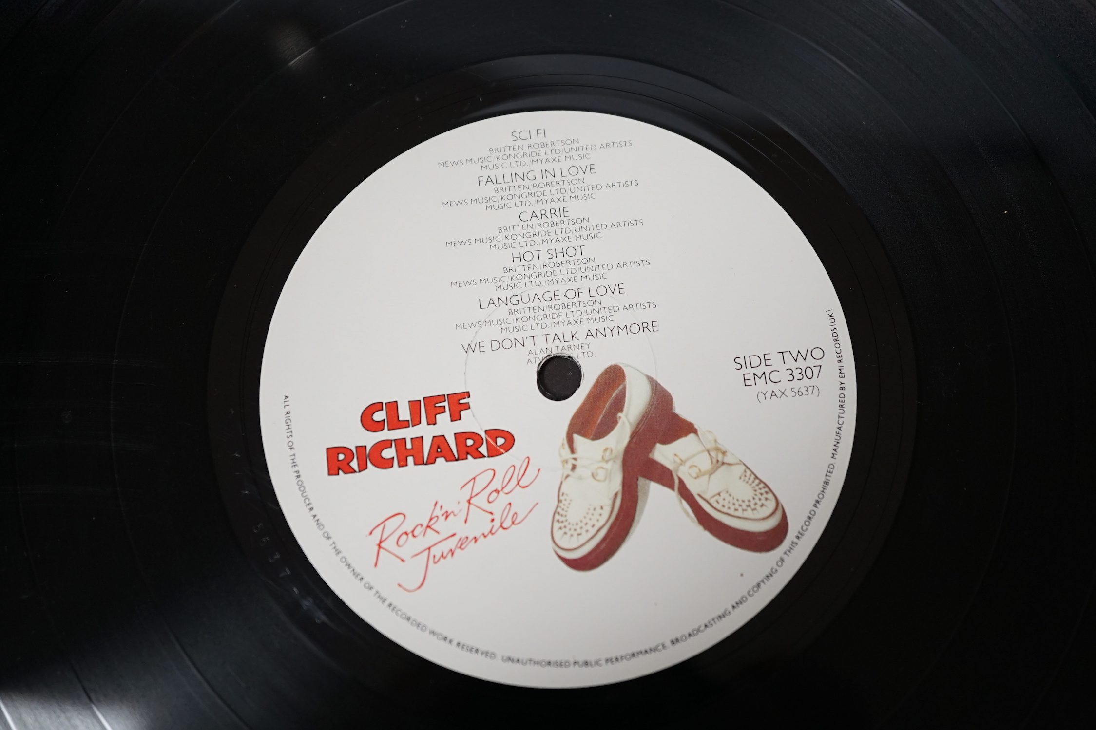 A signed Cliff Richard LP record album; Rock ‘n’ Roll Juvenile, EMC3307, signed in ballpoint ink